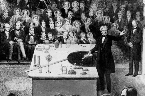 Michel Faraday presentando su experimento con el electromagnetismo